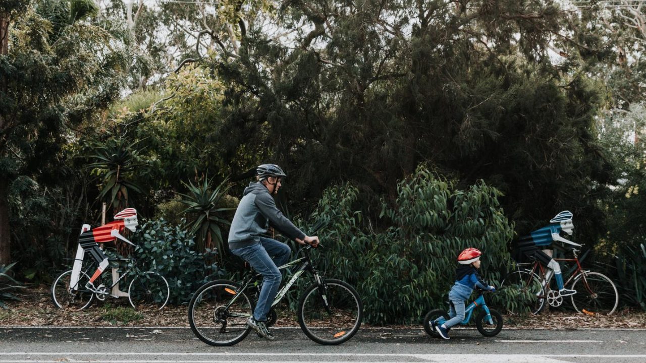 family bike riding murray river