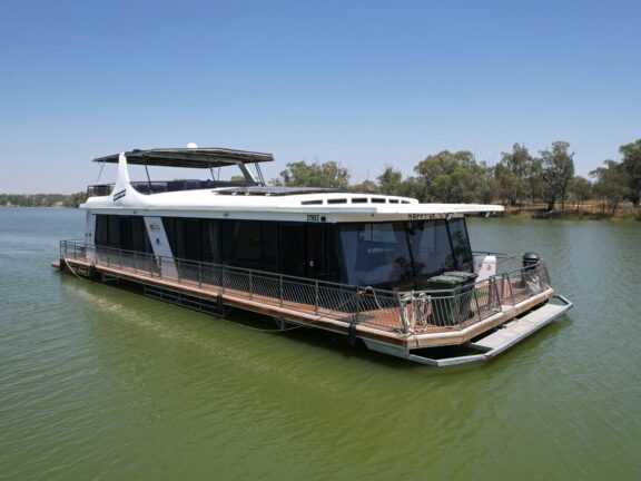 Happy Days houseboat on a calm river