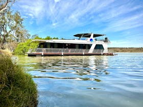 Houseboat named Moonrise on a river
