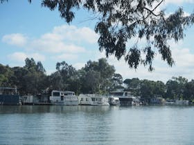 different kinds of boats on a river