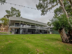 Modern 2-storey house with sloping grassland in the front