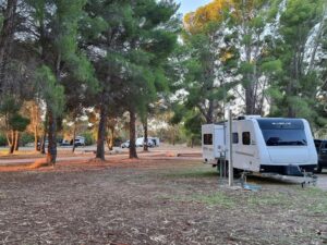 Silverline camper in a campground site