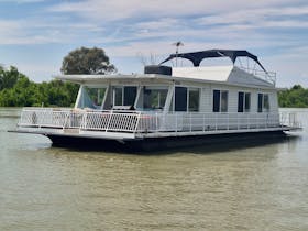 Houseboat named Breakaway on a river